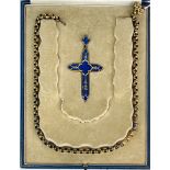 A cased yellow metal and lapis lazuli cross, H. 9cm, with Victorian gold plated chain.