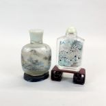 Two Chinese inside painted snuff bottles, one with fixed stopper. H. 14cm.