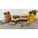 A group of five military binoculars and field scopes.