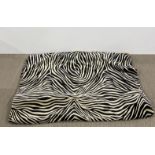 A large printed zebra skin style rug with hessian back, 190 x 270cm.