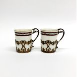 A pair of hallmarked silver cup holders with Royal Worcester porcelain liners, H. 6.1cm. One cup