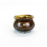 A Chinese splash glazed pottery bowl, H. 7cm. Dia. 11cm.