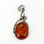 A large 925 silver mounted amber set pendant, L. 6cm.