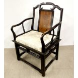 A mid 20th C Chinese hardwood armchair with upholstered cushion, H. 97cm.
