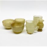 A group of 19th/ early 20th C Chinese turned and carved nephrite jade cups, tallest 5.2cm.