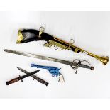 A reproduction brass blunderbuss, L. 70cm together with a Spanish sword, two daggers and a