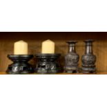Two pairs of carved eastern hardwood candlesticks, H. 17cm.