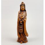 A signed Chinese carved walnut wood figure of the goddess Guanyin, H. 22cm.