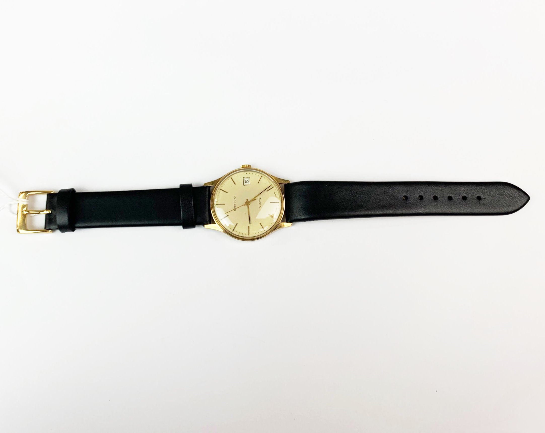 A gent's 9ct gold Garrard quartz wristwatch.
