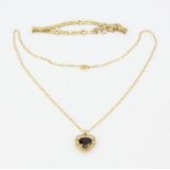 A 9ct yellow gold tourmaline set heart pendant on a 9ct yellow gold chain, L. 40cm, together with