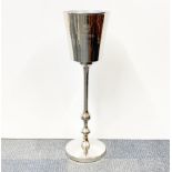 A Bollinger advertising silvered aluminium ice bucket stand, H. 81cm.