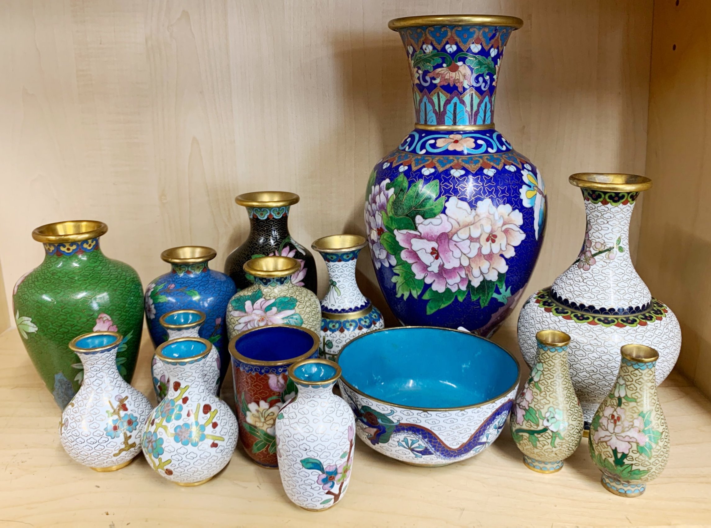 A group of Chinese cloisonne vases.