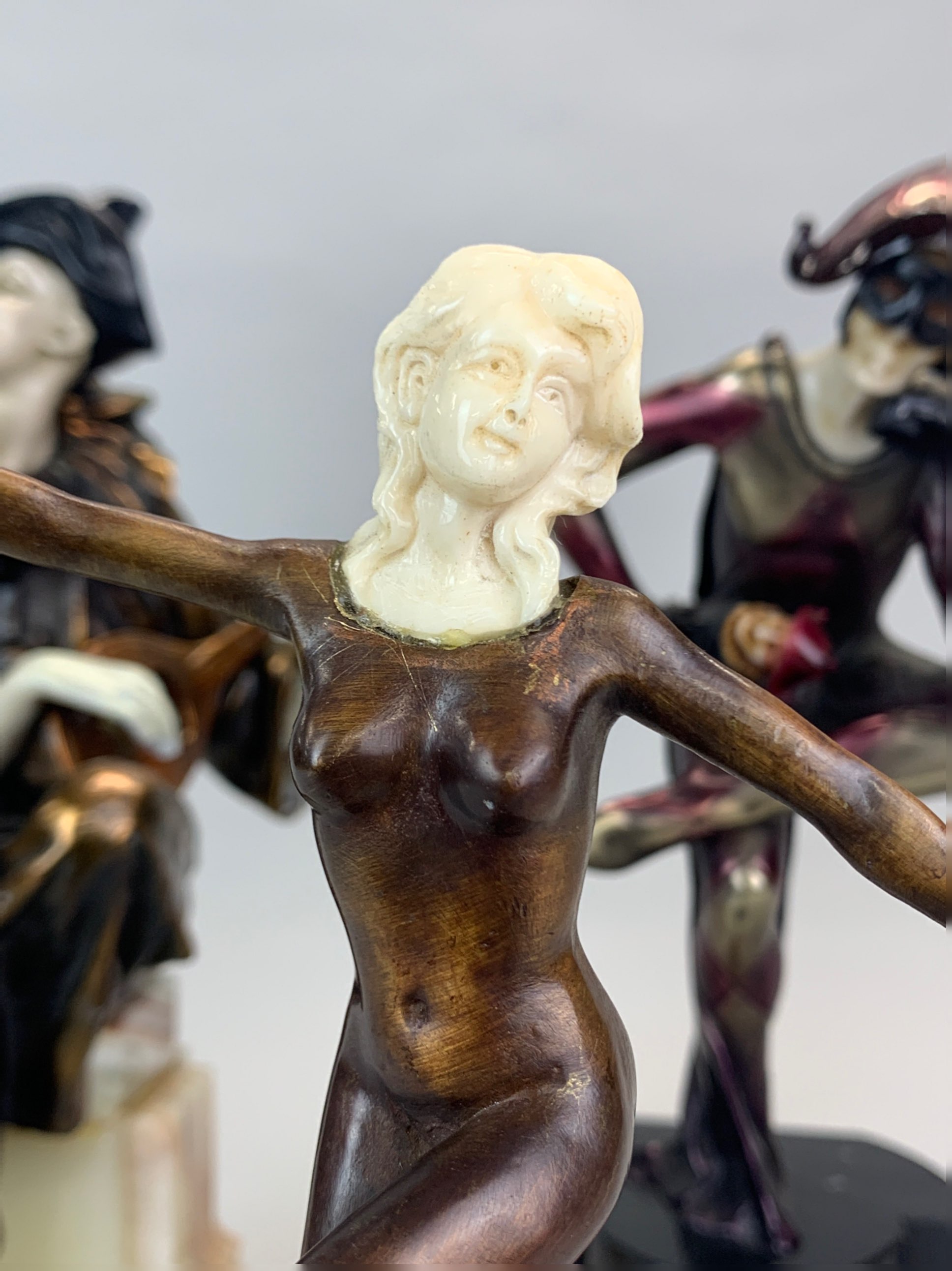 Two resin harleyquin figures on marble bases together with a bronze nude figure on a glass base, - Image 2 of 5