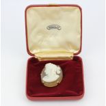 A yellow metal (tested minimum 9ct gold) and hardstone cameo brooch/pendant, L. 5cm.