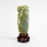 A fine Chinese carved jade model of a vase with dragon and monkey reaching for flowers, overall H.