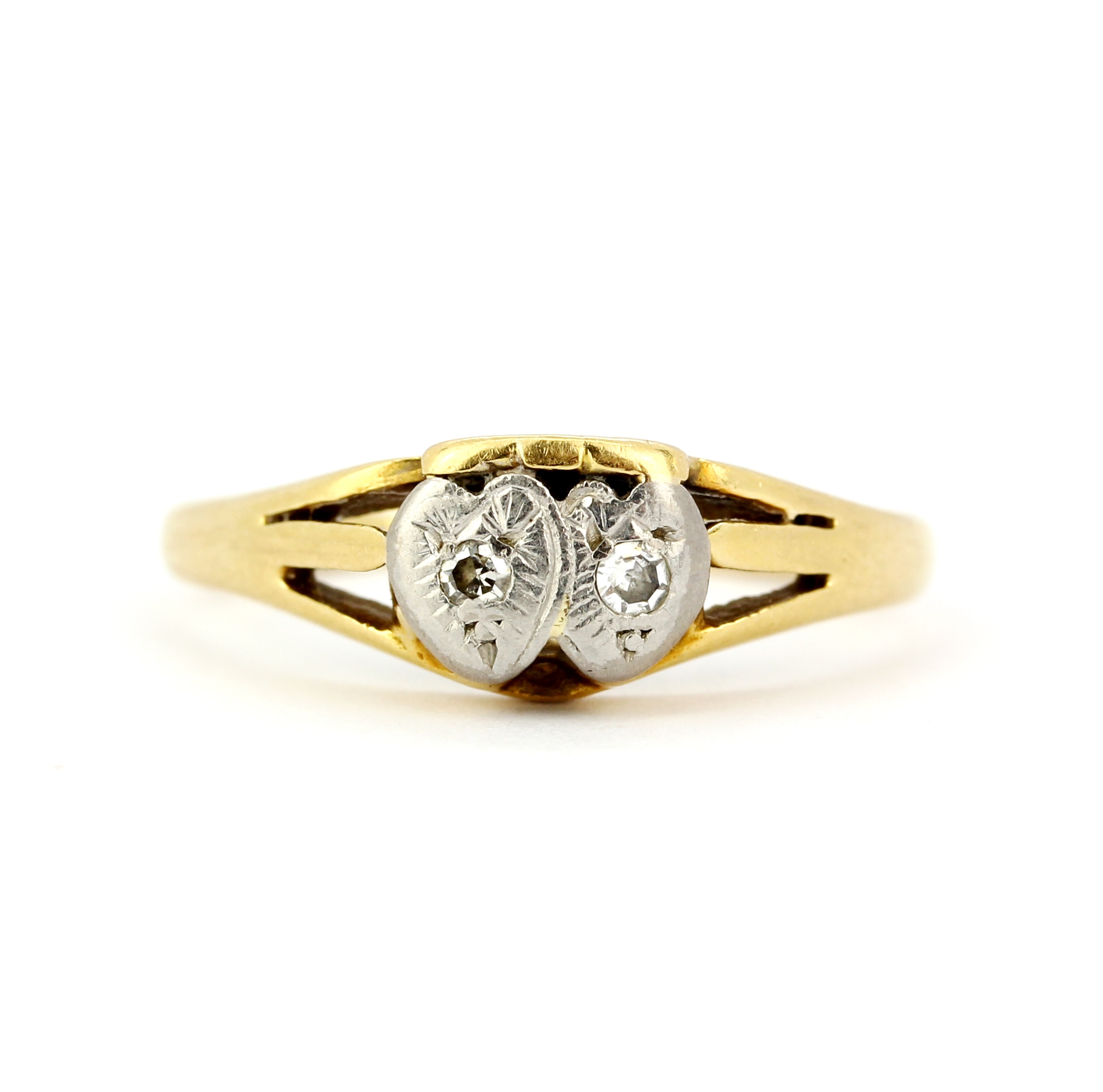 An 18ct gold and platinum diamond set ring, (L).