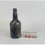 An early glass bottle with an American glass railway engine, bottle H. 24cm.