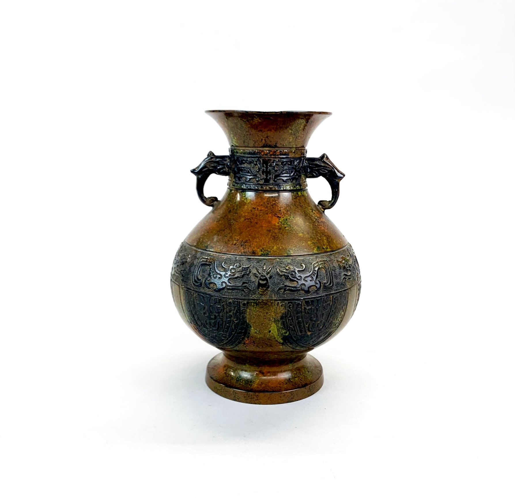 A Chinese pattinated bronze vase with archaic form decoration, H. 21cm.