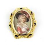 An antique hallmarked 18ct yellow gold and enamel miniature portrait painting inset with small