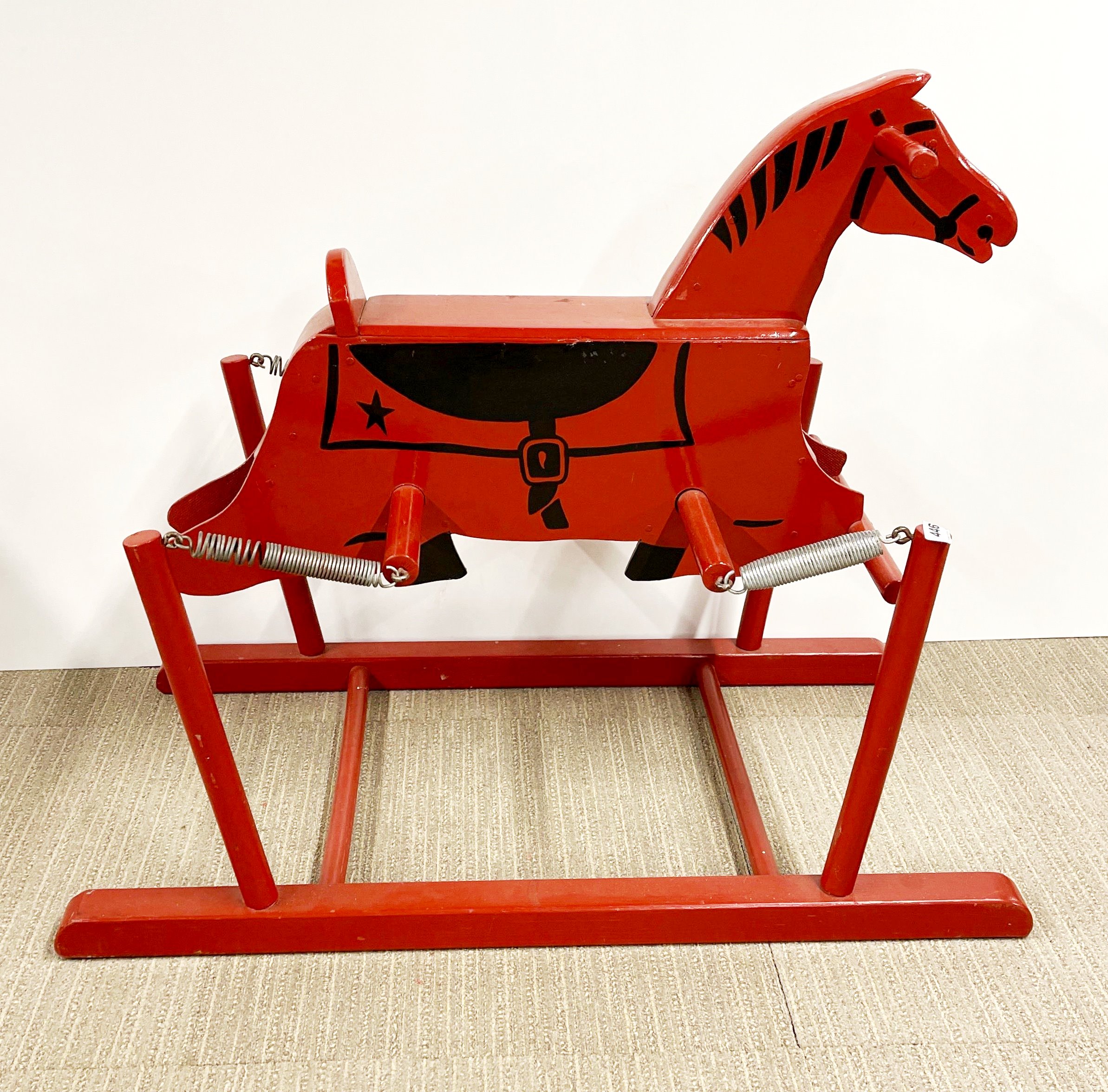 A vintage sprung wooden rocking horse, H. 74cm L. 84cm.