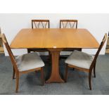 A G plan teak drop leaf dining table and four G plan chairs, table 91 x 30cm, opening to 134cm.