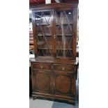 A mid 20th C oak and glass bookcase cabinet, H. 215cm. D. 48cm. W. 105cm.