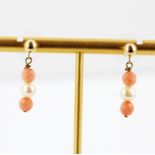 A pair of 14ct yellow gold (stamped 14K) pearl and coral set drop earrings, L. 2.5cm. With plastic