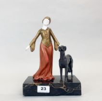 A re-painted Art Deco metal figure of a lady with a dog on a marble base, H. 27cm.