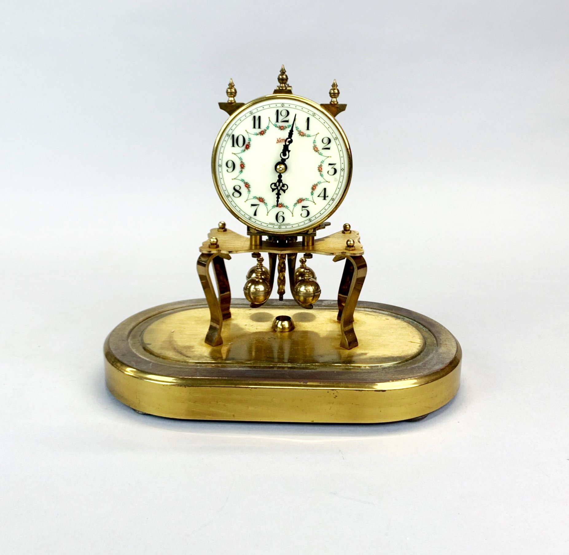 A Kuma mantel clock under glass dome, H.23cm W. 22cm. - Image 2 of 3