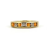 A hallmarked 9ct yellow gold half eternity ring set round cut orange stones and diamonds, (P.5).