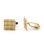 A pair of hallmarked 9ct gold cufflinks, L. 2cm.