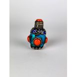 A Sino-Tibetan enamelled white metal snuff bottle, H. 7cm