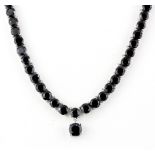 A 925 silver necklace set with round cut black spinels, approx. 28ct total, L. 42cm. With