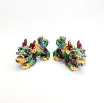 A pair of glazed Chinese dragons, L. 21cm H. 14cm.