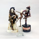 Two resin harleyquin figures on marble bases together with a bronze nude figure on a glass base,