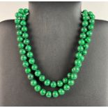 A malachite bead necklace, L. 86cm.