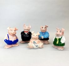 A group of five Wade Natwest piggy banks, tallest H. 18.5cm.