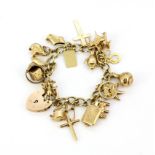 A heavy 9ct yellow gold charm bracelet.