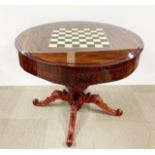 A fitted games table with removable layers revealing roulette wheel etc, Dia. 110cm H. 82cm.