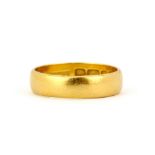 A hallmarked 22ct yellow gold wedding band, (N).