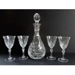 Crystal Decanter and Wine Glasses. A beautiful cut crystal decanter with original stopper and 4