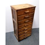 A 1930's oak eight drawer haberdashery chest, 107 x 53 x 36cm.