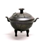 A 19th / early 20th century Chinese bronze censer with archaic form decoration, H. 15cm.