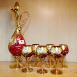 A Venetian gilt glass liquor set, decanter H. 40cm.