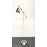 An adjustable steel reading light.