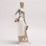 A large Rosal Spanish porcelain figure of a girl with water jugs, H. 39cm.