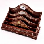An Oriental mother of pearl inlaid stationery rack, 27 x 13 x 18cm.