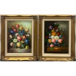 A pair of gilt framed oils on board depicting still life flowers, frame size 45 x 56cm.