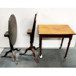 A 20th C desk on castors together with two tilt top tables, desk 75 x 70 x 49cm.