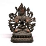 A Tibetan bronze figure of a multi arm Deity, H. 18cm.